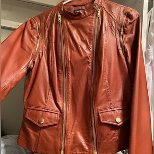 Moto style 100% Leather jacket. Brown. Size M. Brand is Bebe. Staple piece.